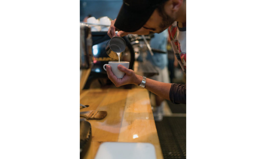 A barista competes in a 2016 latte art contest in Miami. 683x1024 1