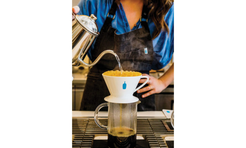 Blue Bottle Coffee Mami manager Michelle Hopper makes pourover coffee 706x1024 1