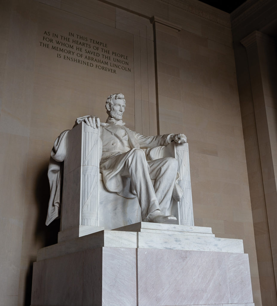 Abe Lincoln hanging out in a chair