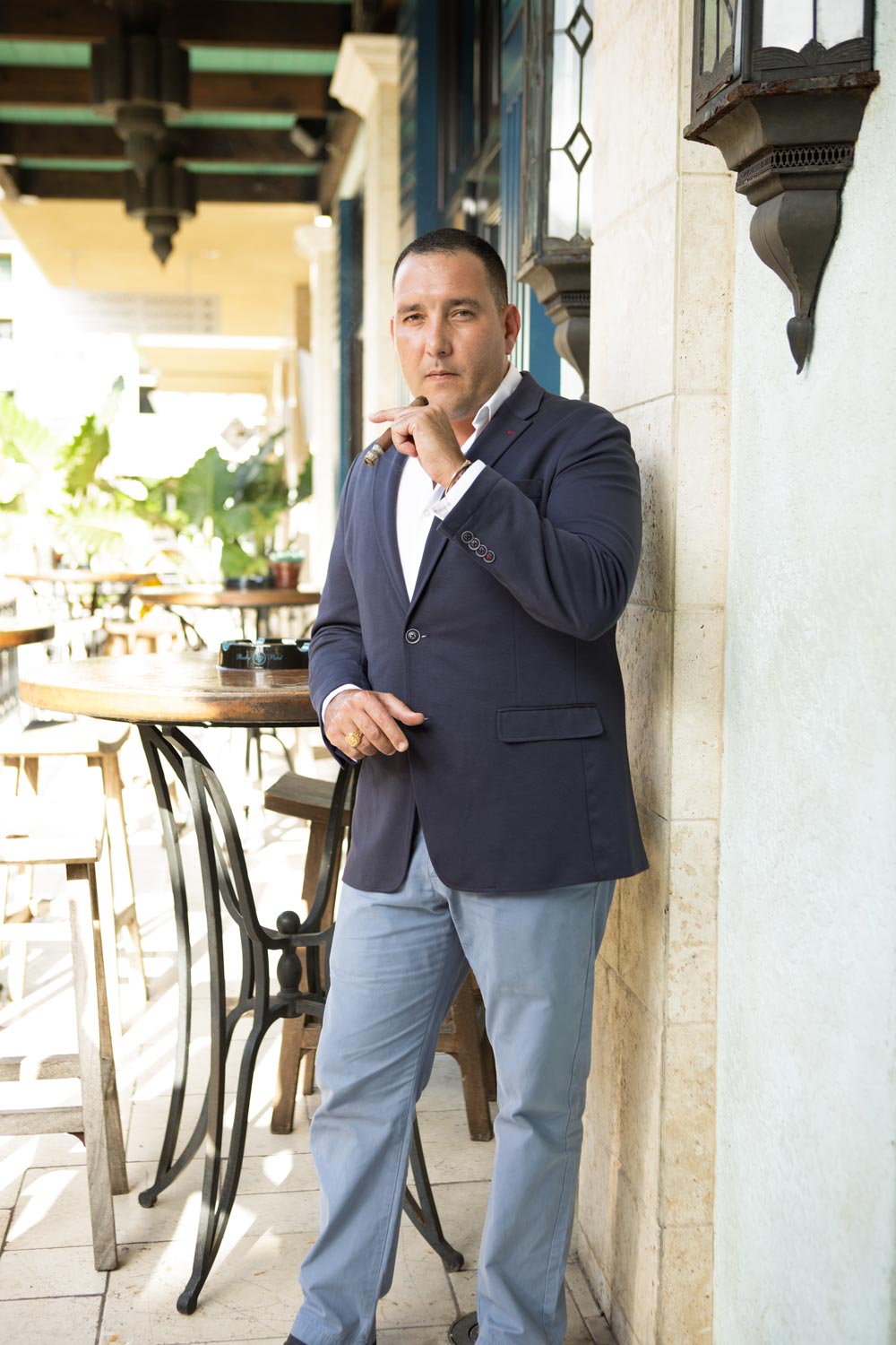  Hamlet Paredes smokes a 25th Year outside Burn, Rocky Patel's Naples, Florida cigar bar. 