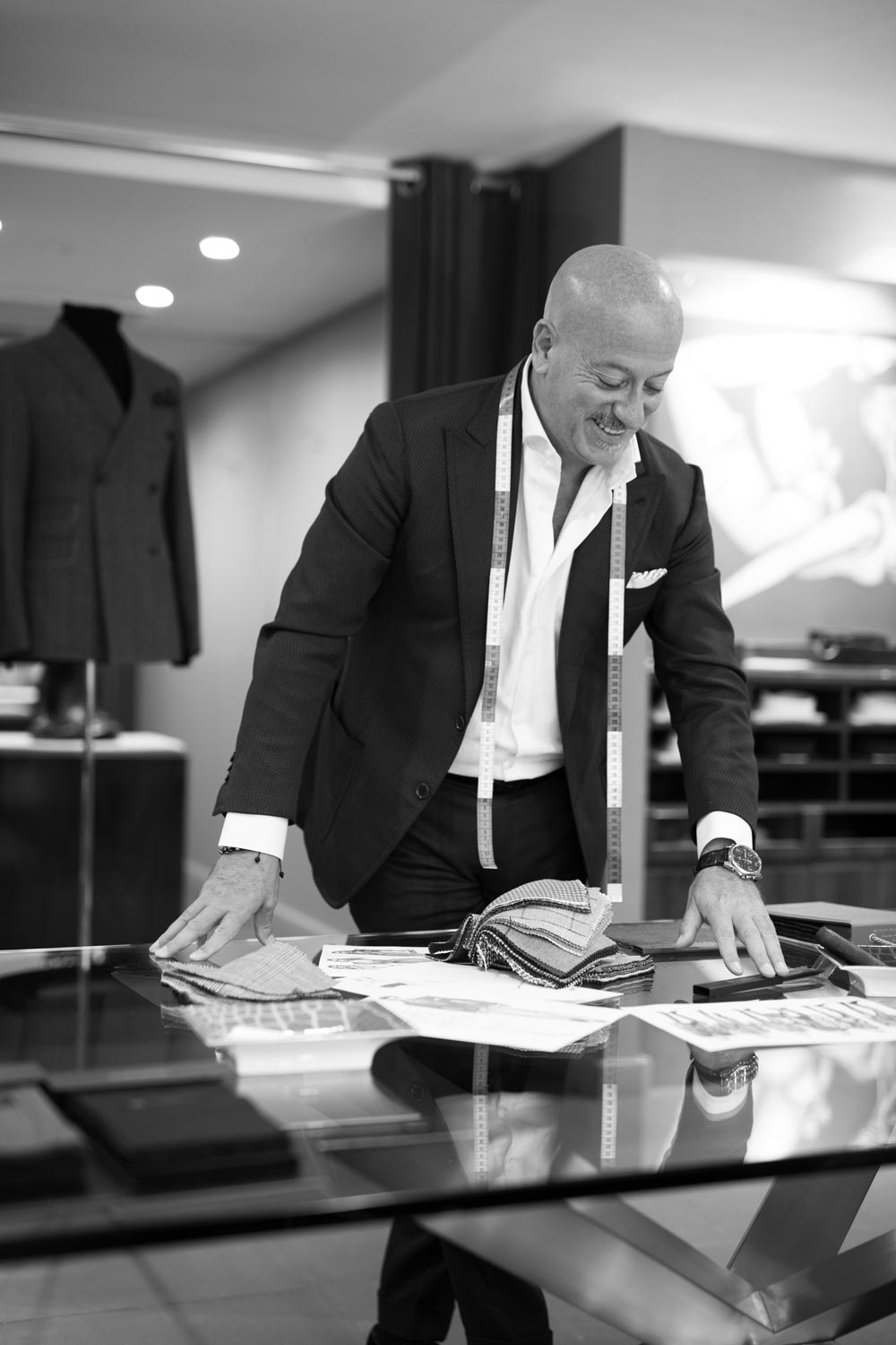  Domenico looks over sketches and swatches.  (photo: Martin Crook)  