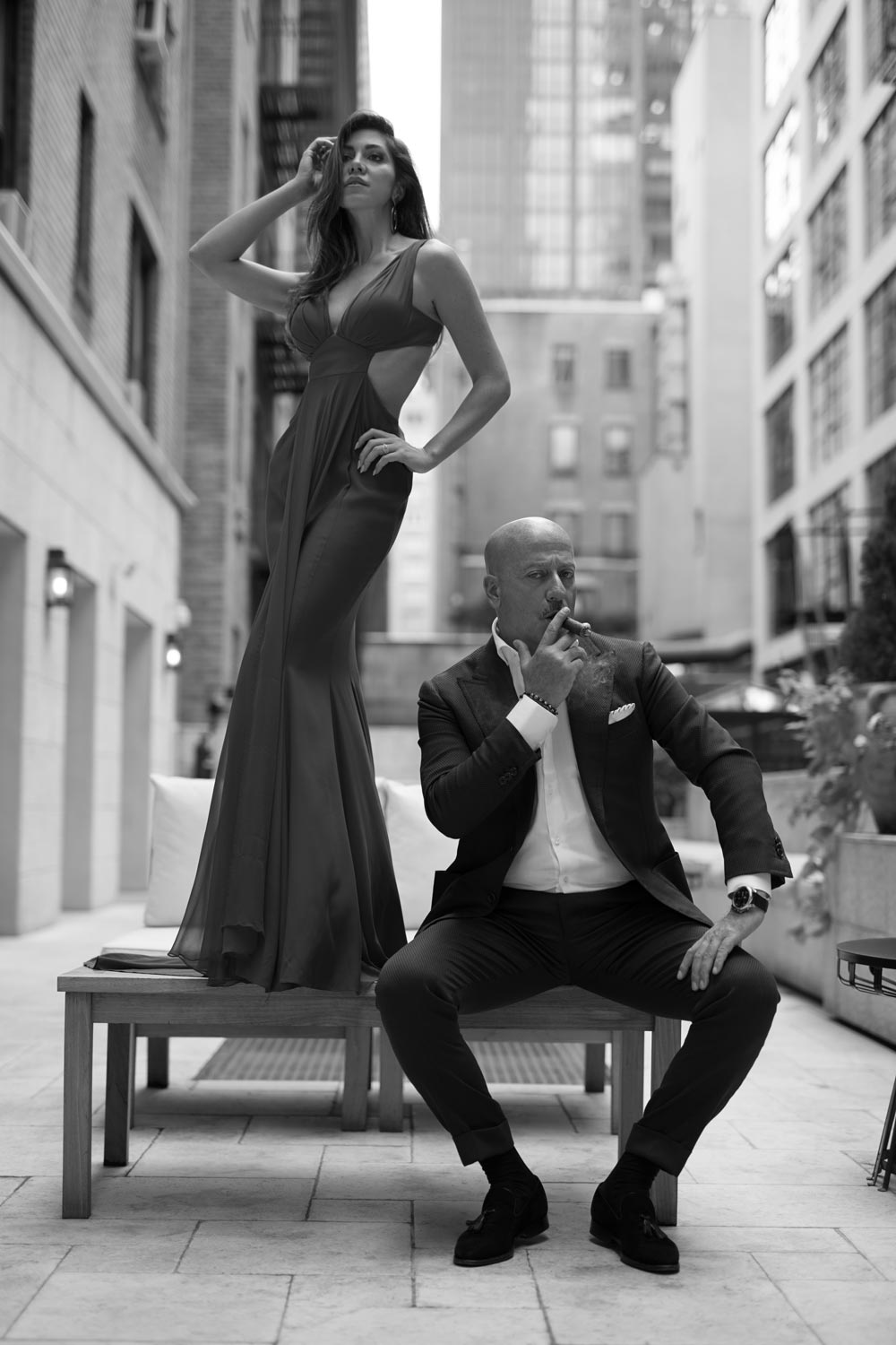  Domenico Vacca, smoking a cigar on the terrace at his Midtown Manhattan store, and his fiancée Eleonora Pieroni  (photo: Martin Crook)  