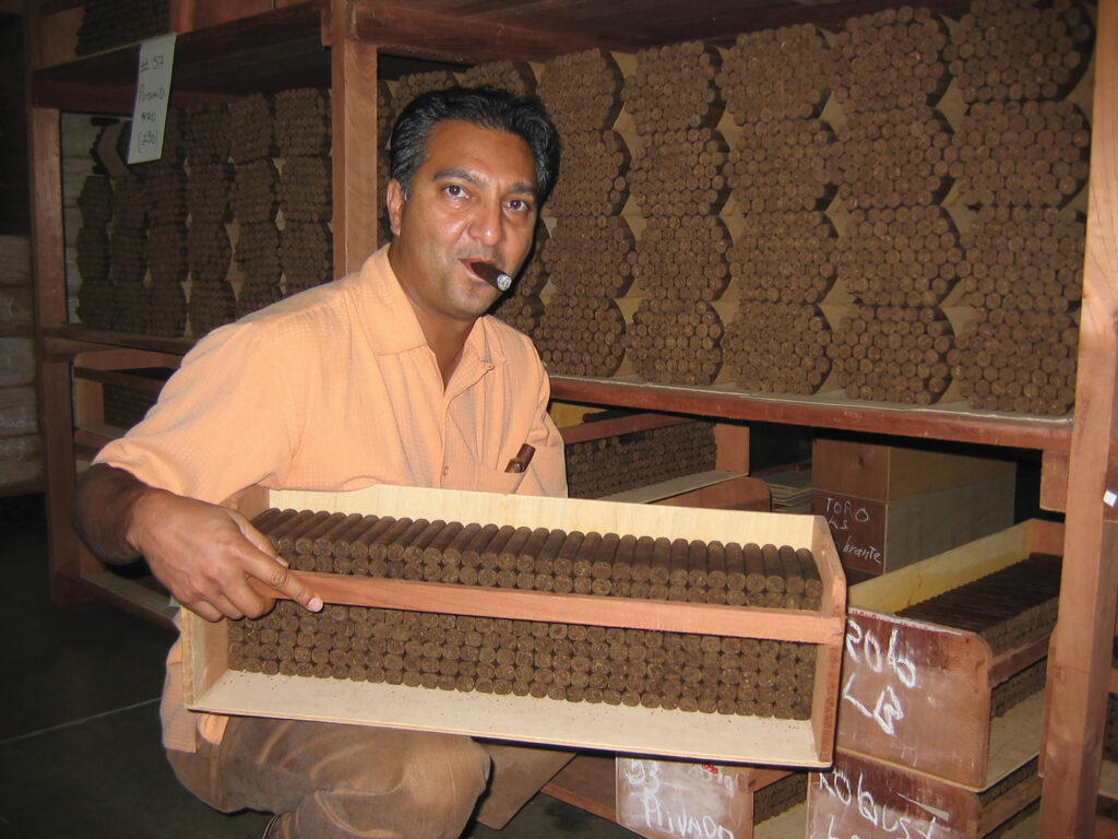 Rocky Patel showing off a tray of The Edge at the factory in Honduras.