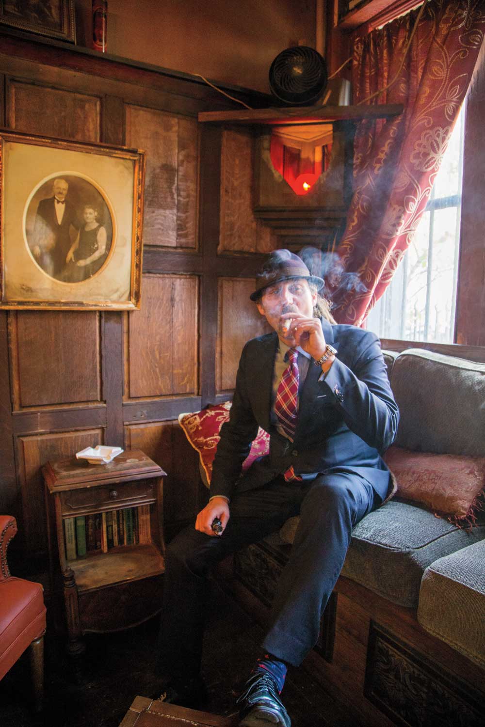 David Diamante lights up at his cigar lounge.