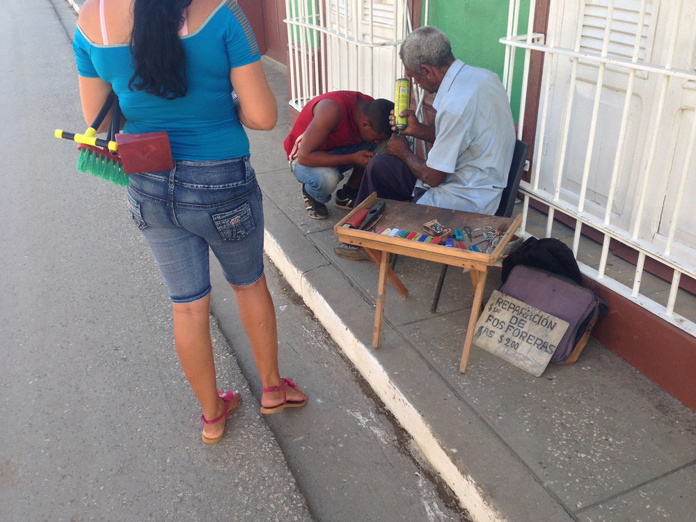   Lighter repair is one of the very narrow trade categories in which Cubans can legally operate independently. (Image:  Reuben Strayer )  