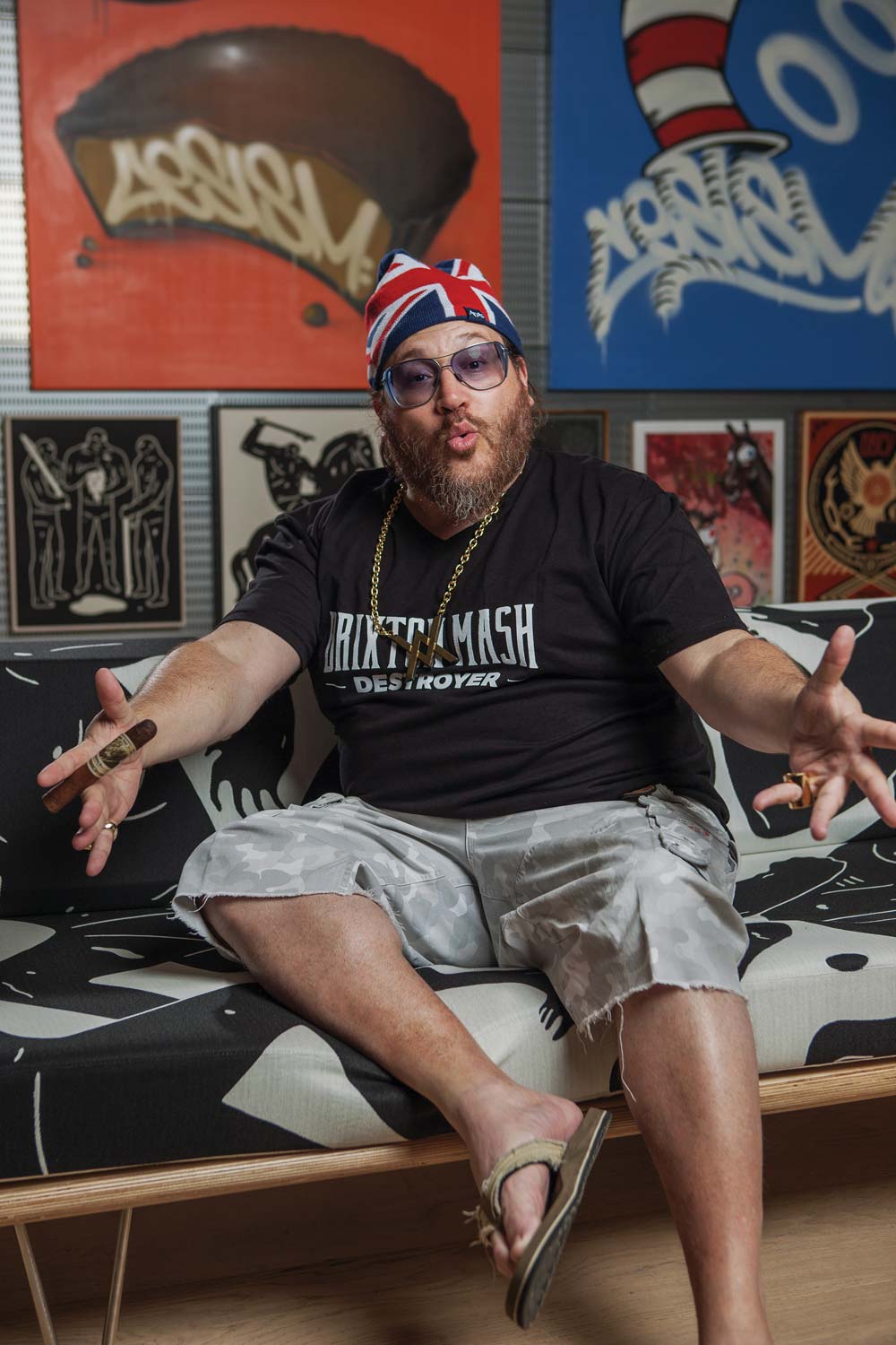 Jonathan Drew strikes one of his signature poses at his Miami apartment.
